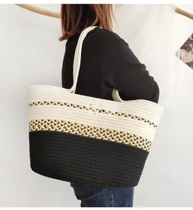 Close-up of woven color-block tote bag showing geometric patterns and cotton cord texture