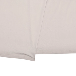 Detail shot of light gray knitted dress fabric with high-quality double-needle stitching