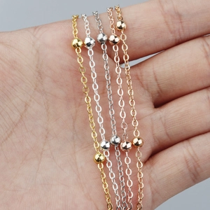 Detailed macro view of copper plated cable chains with small beads in four metal finishes
