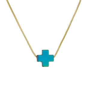 Elegant gold box chain necklace with a minimalist gradient blue cross pendant on white