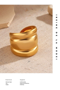 Detailed macro view of 18K gold-plated chunky triple-layer wrap stainless steel ring