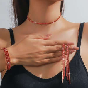 Sparkling red rhinestone jewelry set with tassel earrings and choker on model