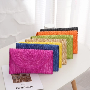 Straw envelope clutch bags in seven vibrant colors for summer vacation styling