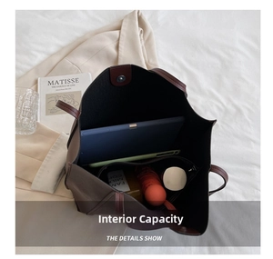 Spacious dark brown leather tote bag interior showing large capacity for tablet and items