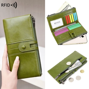 Macro detail of olive green RFID blocking leather wallet showing card slots and zippers