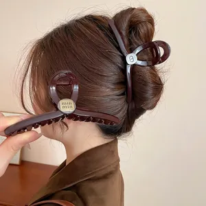 Retro acrylic large hair claw clips in dark brown with elegant metallic brand logo