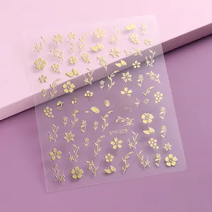 Close-up of cherry blossom nail art stickers with gold embossed floral patterns BTF-S29