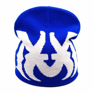 Royal blue knit beanie with white jacquard street style pattern on a white background