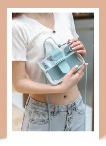 Detail of mint blue PVC jelly handbag with inner leather pouch and adjustable strap