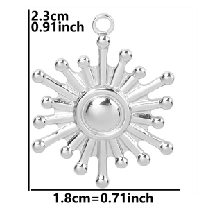 Polished silver snowflake pendant measurement detail 2.3cm by 1.8cm on white background