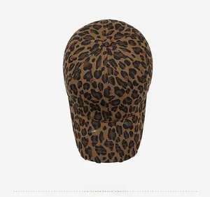 Overhead view of leopard print cotton baseball cap with distressed brim and worn finish