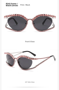 Detail of pink rhinestone cat eye sunglasses with dark lenses and sleek metal temples