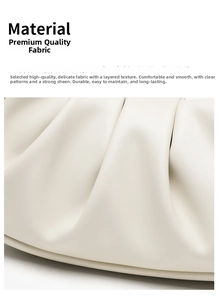 Macro detail of high-quality cream white pleated leather texture on a cloud clutch bag