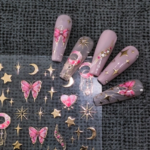 3D bronzing gold nail stickers with pink butterfly and star designs on false nails