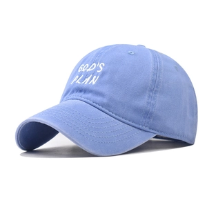 Detail of God's Plan embroidery on light blue washed cotton baseball cap with curved brim