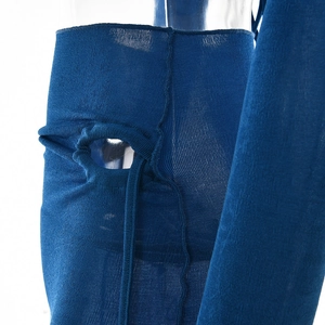 Detail of navy blue knit fabric with hollow-out design and lace-up strap details