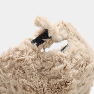 Macro shot of plush khaki faux fur material with soft texture and inner black elastic band