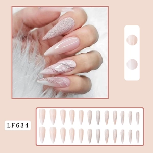 Detail view of LF634 long stiletto nails with nude pink, silver glitter, and marble patterns