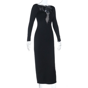 Detailed view of the V-neck sheer mesh and black sequins on the fishtail evening dress