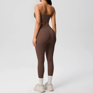 Detail of cross-back yoga top and high-waisted leggings in chocolate brown color