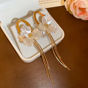 Elegant gold oval earrings with pearl flowers and long chain tassels for women