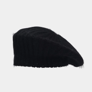 Close-up of black rabbit fur knit beret showing vertical texture and ribbed edge