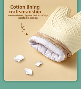 Close-up of heat resistant silicone glove with thickened white quilted cotton lining