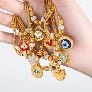 Vintage 18k gold plated titanium steel eye and heart charm bracelet with snake chain