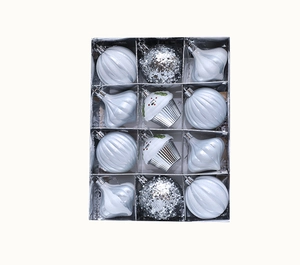 Set of 12 white and silver Christmas ornaments in various shapes within a gift box