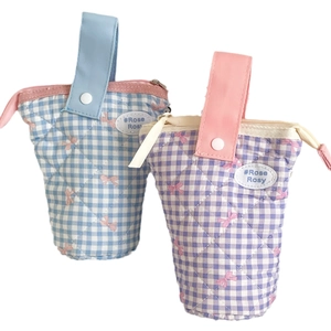Quilted checkerboard pencil case with bow tie design and portable handle in pastel colors
