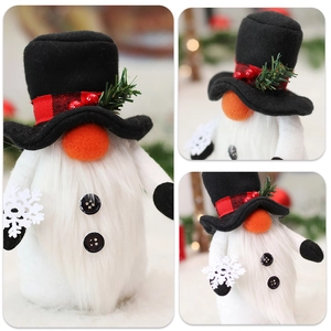 Macro shot of a Christmas gnome doll with pine needles, red berries and a snowflake detail