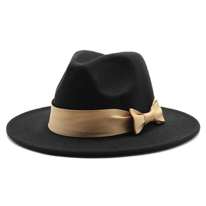 Classic black wool felt fedora hat featuring a beige ribbon band and elegant bow detail