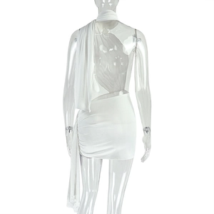 Detail of white backless halter dress featuring side ruched drawstrings and long ribbons