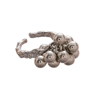 Minimalist silver pleated geometric ring featuring irregular spheres and textured surface