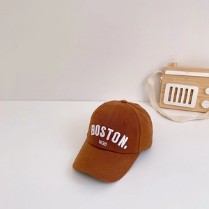 Close-up of brown cotton baseball cap showing white Boston 1630 embroidery details