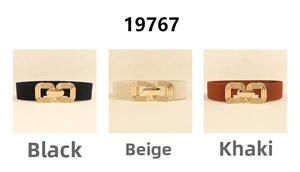 Detailed close-up of elastic waist belts in black, beige, and khaki with gold metal buckles