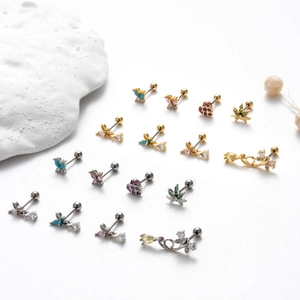 Detail of diverse stainless steel stud earrings with butterfly heart and cz stones