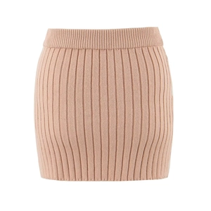 Detailed view of pink ribbed knit skirt featuring elastic waist and vertical stripe texture