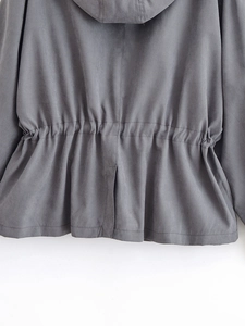 Detail view of charcoal grey hooded jacket featuring back seam and cinched drawstring waist