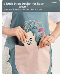 Close-up of waterproof kitchen apron showing large pocket and hello spring floral design
