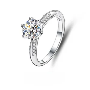 Macro detail of S925 sterling silver ring showing the six-prong setting and side diamonds