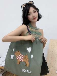 Olive green embroidered nylon tote bag with cute dog pattern and white heart detail