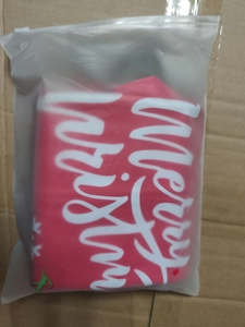 Close-up of inflatable Christmas ball in frosted bag packaging with Merry Christmas text