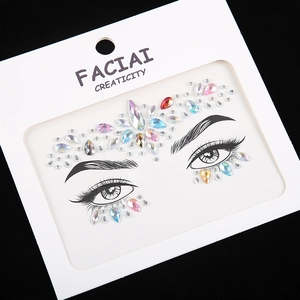 Detail of colorful geometric face jewels and acrylic rhinestones on display card