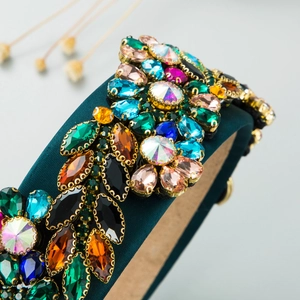 Close-up of Baroque velvet headband with colorful rhinestones and intricate crystal inlay