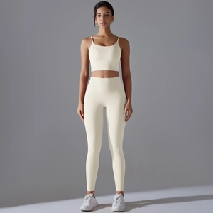 Women's cream yoga set featuring high-waist leggings and thin strap sports bra