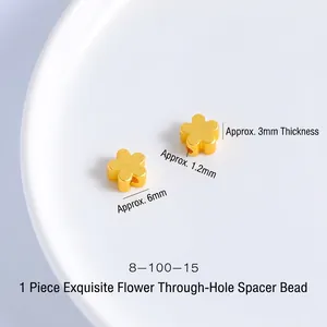 Detailed macro view of 6mm gold flower-shaped spacer bead with matte finish and 1.2mm hole