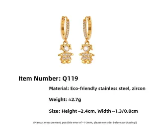 Detail view of gold stainless steel girl earrings with micro-inlaid cubic zirconia