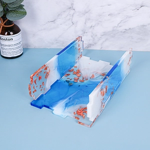 Detail of blue and white resin tray with gold foil flakes for handmade storage box