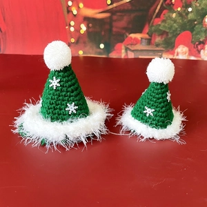 Miniature handmade crochet green Santa hats with snowflake sequins and white fur trim